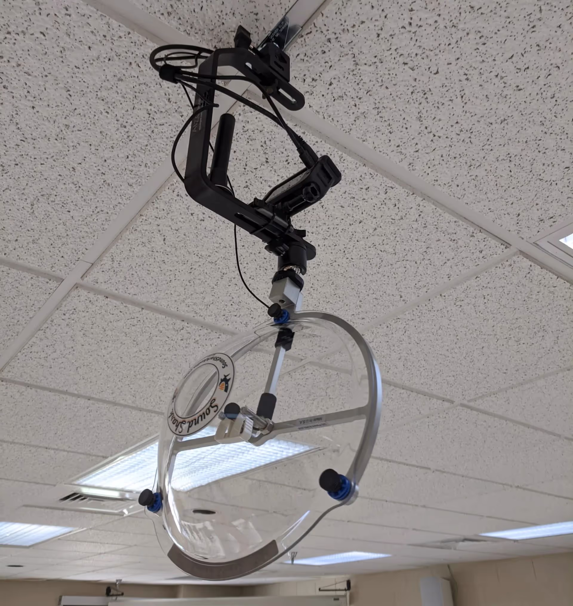 a Sound Shark with a GoPro camera suspended from a classroom ceiling