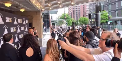 a Sound Shark long-range microphone being used on a DSLR camera at a red carpet event