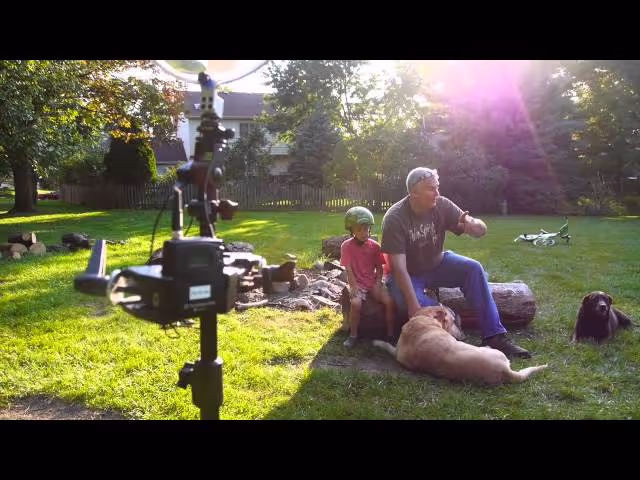 Will Crocket recording a group of kids with a Sound Shark long-range microphone on a mirrorless (DSLR) camera.