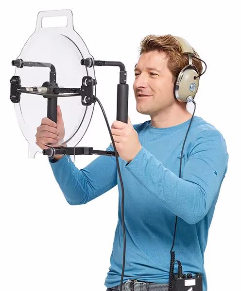an operator holding a KLOVER MiK 16 parabolic microphone