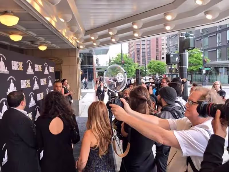 a Sound Shark long-range microphone being used on a DSLR camera at a red carpet event
