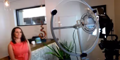 a Sound Shark long-range microphone being used to conduct an interview