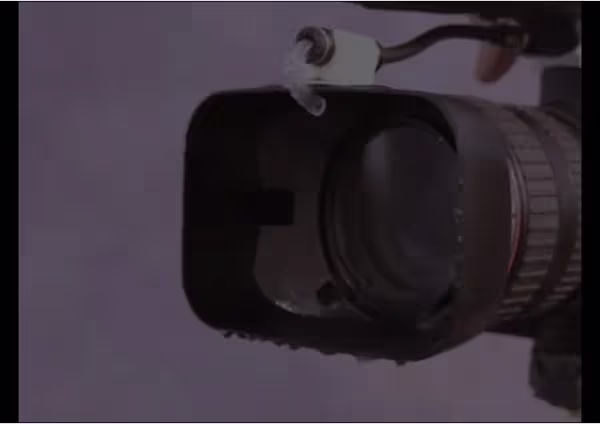 a camera with a Klear Shot FP lens cleaner attached to it